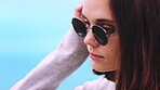 Thinking, sky or woman outdoor with sunglasses, past memory or fresh air on weekend break. Mindfulness, space or person outside with shades, reflection mindset or peaceful perspective in free time.