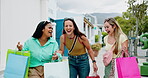Walking, women and laughing with shopping bag on street, funny conversation and sale purchase for smile. Retail therapy, outdoor or friends with consumer humor for discount promotion, bonding or deal
