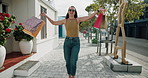Laughing, shopping bags and turn with woman on sidewalk in city for energy or satisfaction. Deal, retail sale and spin with excited person outdoor for celebration of consumerism, discount or purchase