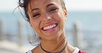Face, vacation and happy woman by ocean with wind, peace and laugh on tropical island in summer. Portrait, holiday and person by promenade for trip with breeze for tourism, getaway and funny by sea