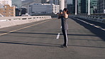 Fitness, woman and stretching on break in city for wellness, workout recovery and injury prevention. Cool down, rest and runner on road outdoor for relax after training, exercise or health on bridge