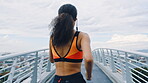Fitness, back or runner on bridge with earphones, cardio playlist or stamina exercise in speed activity. Fast, intense sprint or woman with tech, sports podcast or endurance workout in city.