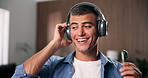 Headphones, music and man dance in home with album, sound and happy with streaming service on phone. Mobile, house and person listen to audio with radio, online playlist and subscription on internet