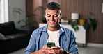 Earphones, music and man with phone in home for album, sound and happy with streaming service. Mobile, house and person listen to audio with radio, online playlist and subscription on internet