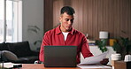 Laptop, review and man with paperwork for remote work, data entry and update records for bookkeeping. Reading, info maintenance and freelancer with pc to transcribe document, check and audit in home