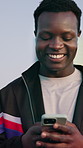 Fitness, phone and black man with earphones in city, streaming music and sound with smile. Mobile, sports and person outdoor with audio, walking and online search for song with subscription service