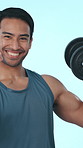 Studio, muscle and face of man with weights for bodybuilder, exercise and training. Happy, strong and portrait of person with dumbbells for weightlifting, workout and strength on blue background