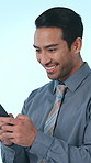 Laugh, phone and business man in studio with social networking, communication and online chat. Happy, typing and person on smartphone for internet, mobile app and connection on blue background