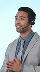 Call center, talking and business man in studio for customer service, contact us and consulting. Corporate, professional and person with headset for assistance, crm support or help on blue background