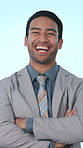 Crossed arms, business and face of man in studio with pride, ambition and laugh for finance career. Corporate, entrepreneur and portrait of person with confidence for financial job on blue background