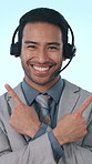 Call center, pointing and face of man in studio for decision, info and options for advertising. Corporate, portrait and person with headset for customer service, contact us or news on blue background