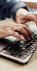 Typing, laptop and senior hands at table, technology competence and keyboard game for skill development Home, digital activity and person with computer for accuracy challenge, speed test and practice
