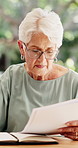 Senior woman, writer and reading with document outdoor for story, copywriting or journalism. Elderly, female person or author with research and novel for fantasy, perspective or literature in house