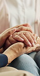 Caregiver, holding hands or old person in house with comfort, understanding or empathy in assisted living. Compassion, elderly patient or nurse in home with help, support and trust in retirement care