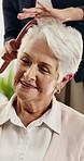 Caregiver, talk and old woman in nursing home with hairbrush, support and assistance for grooming. Volunteer service, elderly person and chat in retirement center with hair care, help and kindness.