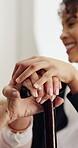 Caregiver, hands and old woman in nursing home with cane, support or help for injury rehabilitation. Nurse, walking stick and senior person with disability, assistance or healing in retirement center