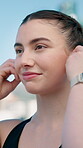 Happy, athlete and woman with earphones on break, fitness or rest after workout for health and music. Happiness, runner and person with tech for audio, wellness and streaming song in city and outdoor