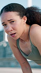 Runner, tired and face of woman for rest in city for exercise, cardio workout and training. Portrait, athlete and person with fatigue, sweat and breathe for active hobby, wellness and fitness in town