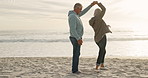 Love, dance and sunset with old couple at beach for travel, summer vacation and anniversary getaway. Support, holding hands and retirement with senior people for holiday, bonding and romance together