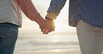 Love, holding hands and travel with couple at beach for support, bonding and romantic getaway. Travel, holiday date and connection with people outdoor for summer vacation, relationship and sunset