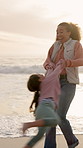 Beach, spin and mother with girl, smile and bonding together for love, vacation and funny. Ocean, family or mama with daughter, happy people or tropical island for summer holiday, laughing or playing