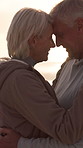 Outdoor, hug and senior couple with love for bonding, speaking and romantic moment for connection. Affection, sunset and old people with flare for partner admiration, talking and smile for support