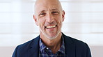 Business, face and funny with mature man in office for corporate development or management. Confidence, experience and professional with manager laughing on wall background at work for career or job