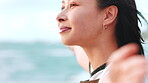 Woman, relax and reflection on beach with open arms, peace and tranquility for inspiration on vacation. Person, mindfulness and thinking outdoor by ocean with wind, wellness and freedom on holiday.