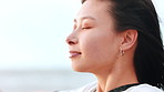 Freedom, thinking and woman on beach outdoor for summer idea, planning or vacation memory. Female person, travel or wind for reflection, calm morning and weekend break or holiday getaway with space