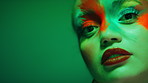 Neon light, shine and woman with makeup, face paint and aesthetic with transformation on background. Portrait, cosmetics or serious person with art in studio, creative change and touch for beauty