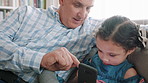Phone, game and grandfather with kid on sofa in home for learning, development or growth together. Scrolling, technology and senior man with girl child on cellphone for online gaming in living room.