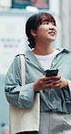 Travel, girl and walking with phone in city for direction search, online location and holiday abroad. Tourist, asian person and smartphone in urban town for internet guide, sightseeing and navigation