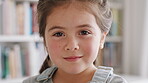 Calm, face and kid on break in house, peace and growth of child in living room and relax on holiday. Portrait, smile and comfortable on weekend in lounge, childhood development and girl in Canada