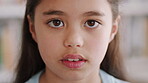 Face, future and learning with girl in classroom for child development, knowledge or study. Academics, class and education with student kid in elementary school for curriculum, growth or syllabus