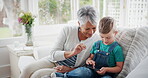 Grandmother, phone and pointing with boy on sofa in home living room for bonding, love or visit. App, gaming or scrolling with child grandson and happy old woman in apartment together for streaming