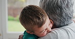 Adoption, grandmother or boy in home with hug, childcare or bonding together in healthy relationship. Love, old woman or grandchild with embrace, support or family connection in childhood development