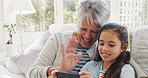 Grandmother, girl and phone in house with video call, wave and bonding together on weekend break. Happy, old woman and grandchild on couch with tech, contact or blow kiss for virtual conversation.