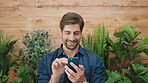 Copywriting, smile and man in office, smartphone for social media and digital app for funny meme. Person, internet and writer in workplace, online humor and cellphone for email and message to contact