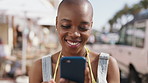 Woman, phone and happy with texting in street on travel, scroll or funny chat with online dating. Person, smartphone and smile on mobile app for meme, contact and social media with tourism in city