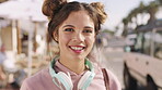 Employee, face and woman with headphones in city, media and journalist with smile for career growth. Travel, reporter and happy person with tech on street, confident and creative opportunity in USA