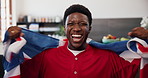Celebration, face and flag of United Kingdom with black man watching tv in home living room. Cheering, Great Britain and support with excited African fan in apartment for streaming or subscription