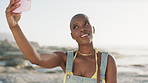 Black woman, selfie and smile at beach on vacation in summer, travel or post on social media. Girl, influencer and happy with photography for memory, mobile app or content creation on seaside holiday