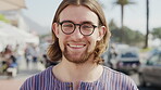 Travel, face or man in city with glasses, positive attitude or summer break in urban vacation. Happiness, tourist holiday or person with specs, good mood and town sightseeing in Los Angeles.