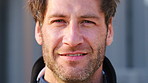 Happy, confident and face of man outdoor with wind for vacation, getaway or weekend trip. Travel, smile and portrait of male person with positive attitude for breeze in hair on holiday in London.