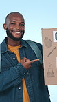 Face, man and poster for education, pointing and rally for quality schools on blue studio background. Person, gesture and cardboard for better lives, university and freedom for knowledge or learning