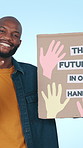 Pointing, poster and black man in studio, face and sign for future, information or vision. Happiness, motivation or African person with cardboard for news, creative or inspiration on blue background
