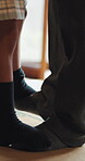 Father, girl and feet with dancing in home, bonding activity and family support for child development. Apartment, learning steps and legs of people with moving together for connection, love and care