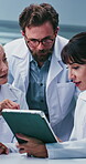 Scientist, team or tablet with discussion in lab for vaccine trial, planning procedure or innovation. Biotech, people or tech with feedback for medical experiment, research method or cure development