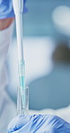 Test tube, exam and scientist with pipette in lab, analysis or medical research for drug development. Clinic, biotech and mature woman with eyewear for safety, pharmaceutical and study with chemical