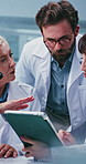 Scientist, team or tablet with research in lab for vaccine trial, planning steps or procedure discussion. Science, people and tech with feedback for medical study, method brainstorming and innovation